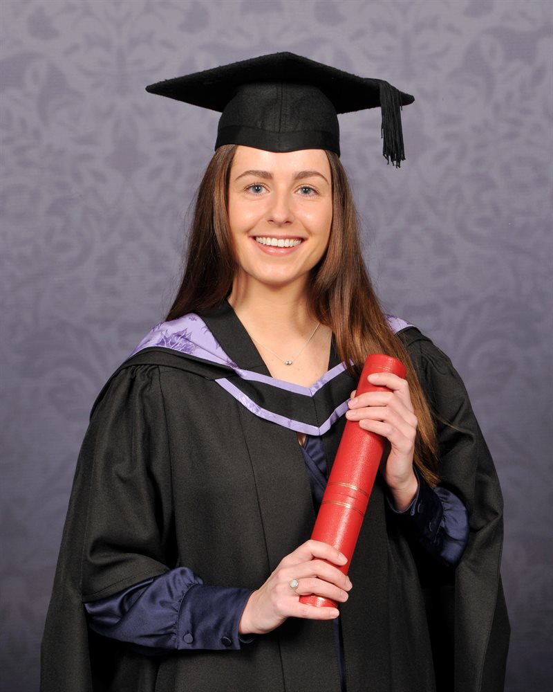 Nicole Marlow smiling at her podiatry graduation